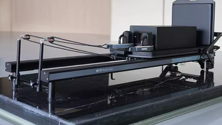 Premium Black Aluminum Pilates Reformer with Modern Studio Design