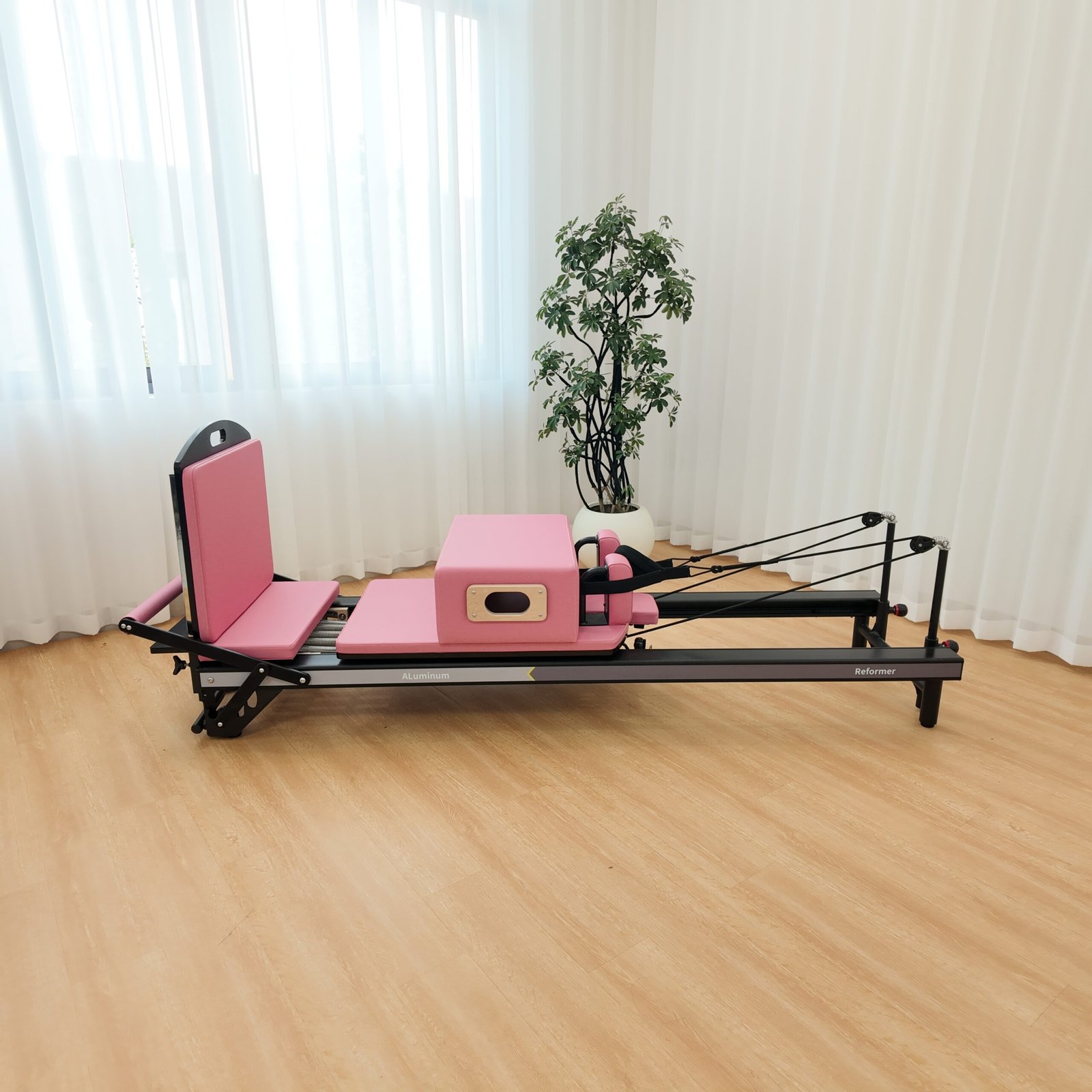 Premium Black Aluminum Pilates Reformer with Modern Studio Design