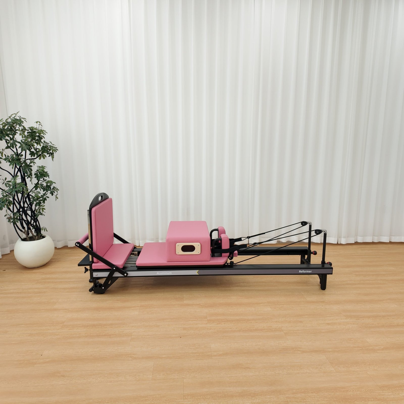 Premium Black Aluminum Pilates Reformer with Modern Studio Design