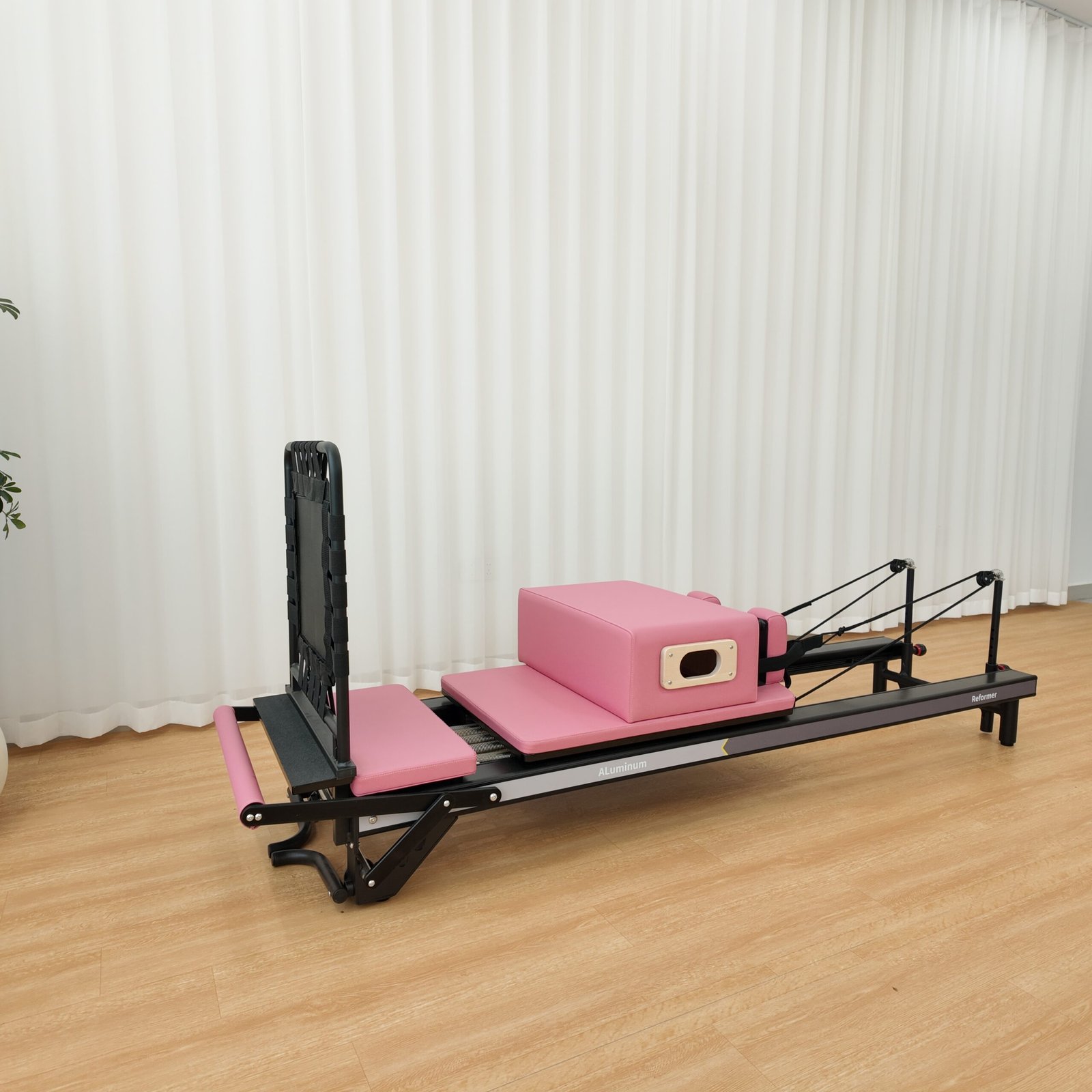 Premium Black Aluminum Pilates Reformer with Modern Studio Design