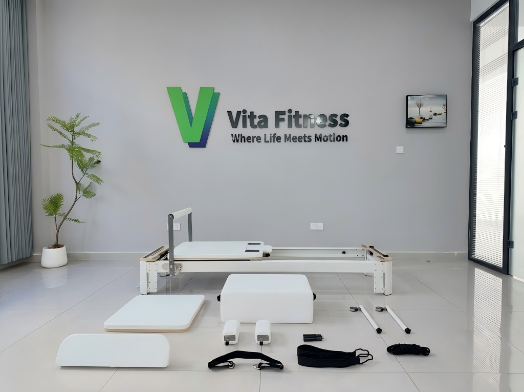 Commercial Pilates training equipment details including springs straps and frame