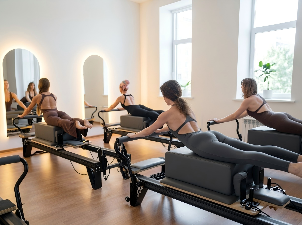 Boutique fitness studio with Pilates Reformer class setup