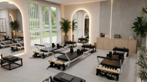 Large gym Pilates equipment area with Reformers and apparatus